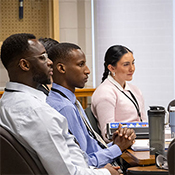 Seated DICE participants listen attentively during a classroom training session at the RCMP Training Academy.