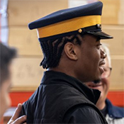 A DICE participant is being fitted for a DICE training uniform.