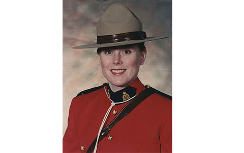 Retired RCMP member Laurie White in red serge uniform.