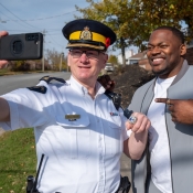 An RCMP officer wears the championship ring of Henoc Muamaba.