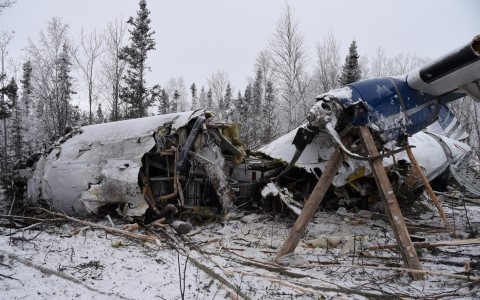 Thin layer of snow covers over the ruins of a catastrophic plane crash.