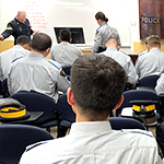 Cadets holding their Silent Partner Cards.
