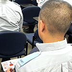 Cadet holding their Silent Partner card.