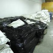 Pallets of bags and drums of chemicals located and seized during the execution of the search warrant.