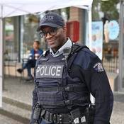 Cst. Dwight Martin stands outdoors in uniform at Hats Off Day in North Burnaby