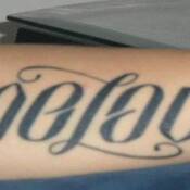 Left arm tattoo