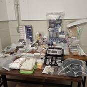 Suspect illicit drugs, paraphernalia and money