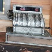 An antique cash register displayed at the Yukon Suspension Bridge.