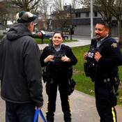 CRU officers speak with a resident at Memorial Peace Park