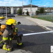 Photo of the students learning to use high-pressure fire hoses