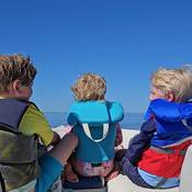 children wearing life jackets