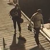 Photo of suspects in theft from boats at Pedder Bay Marina on Sept 6 seen walking and holding stolen items.