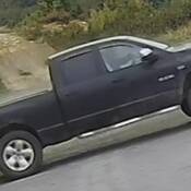 The stolen 4-door crew cab, black 2008 Dodge Ram pickup truck;