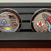 RCMP challenge coin with art designed by a youth who lives in Quesnel, BC.