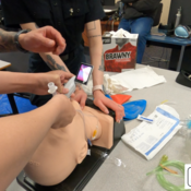 Photo of the students learning how to administer an airway on a patient