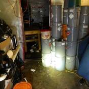 Photo of barrels of chemicals discovered by the CLEAR Team inside the clandestine drug lab.