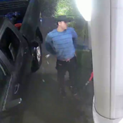Suspect wearing blue/green shirt