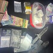 Photo of illegal drugs, Canadian currency, a knife and cigarettes