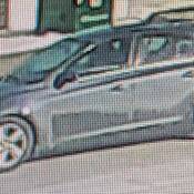 The vehicle is described as a blue or grey 4-door Chevrolet Cruze, 2010 or similar model.