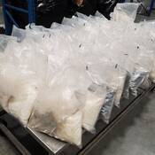 Exhibit bags containing methamphetamine seized during the investigation.
