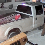 File 2026-551 - Suspect in reddish-brown snow suit exiting white pickup truck
