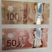 Counterfeit $100 and $50 bills