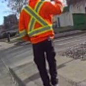 Back view of man videotaping