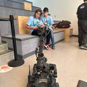 Kids operating police robot