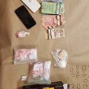 Drugs, cash, and cell phones seized from man on March 20, 2026.