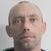 Aliases: Buzy, Kenneth Bell, Bizy, Brian Merasty<br />
<br />
Gender: male<br />
<br />
Age: 40<br />
<br />
Height: 5’8” <br />
<br />
Weight: 139 lbs<br />
<br />
Hair: blonde<br />
<br />
Eyes: green<br />
<br />
Scars/Tattoos:<br />
•	Tattoo – left forearm – BIZY<br />
•	Tattoo – right forearm – geometric pattern<br />
<br />
May be in these communities: <br />
Ituna, SK; Melville, SK; Lipton, SK; Muskowekwan First Nation, SK; Lanigan, SK; Meadow Lake, SK<br />
<br />
Offences: <br />
Sexual assault, sexual interference, invitation to sexual touching, sexual exploitation of a young person, administering noxious thing