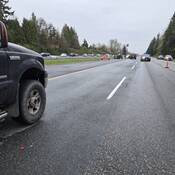 BC Highway Patrol cruisers blocking Highway #1 as police investigate a serious motorcycle crash