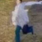Photo of Abbriella Guthrie leaving the residence wearing an oversized grey sweatshirt and turquoise sweatpants.