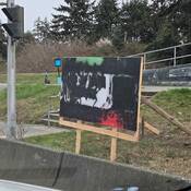 Vandalized sign at Departure Bay Rd and HW 19A