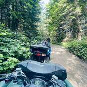 Police officer completing safety inspection on trail