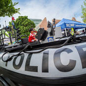 child in police boat