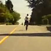 Youth doing a wheelie on E-dirt bike