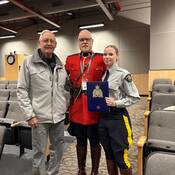 (Left to right) Retired Cpl. Bruce Lindsay, his son Cst. Bruce Lindsay, and his granddaughter Cst. Morgan Lindsay at her Depot graduation in February 2026.