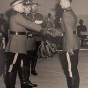 Commissioner Lindsay presenting his son's badge to him at Depot in 1969.