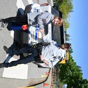 Photo of student standing beside "Wee Woo Wagon"