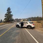 Photograph of marked RCMP vehicle conducting patrols in evacuated neighbourhoods in Summerland, B.C.