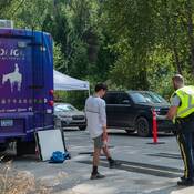 A police officer supervises a Standardized Field Sobriety test for drug-impaired driving