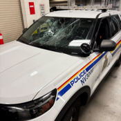 Picture of a police vehicle with damaged windshield.