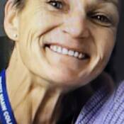Photo of Tania Langley with lanyard around her neck
