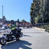 Photo of one of Mission RCMP’s Traffic Services officers on a police motorcycle, escorting the Cops for Cancer riders out of the detachment.