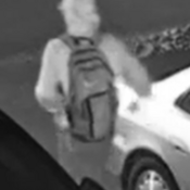 Rear photo of Suspect #2, showing backpack.