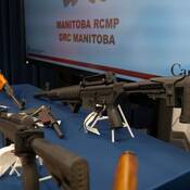The Manitoba Integrated Law Enforcement Team (MILET) seized 13 firearms and approximately 20,000 rounds of ammunition after executing search warrants at two residences in the RM of West St. Paul on Sept. 11.