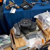The Manitoba Integrated Law Enforcement Team (MILET) seized 13 firearms and approximately 20,000 rounds of ammunition after executing search warrants at two residences in the RM of West St. Paul on Sept. 11.