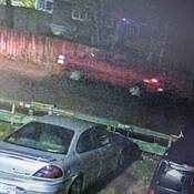 Photo of the red suspect truck, taken from video surveillance. The photo is very blurry.
