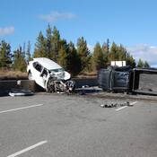 A black Toyota Tacoma and a white Toyota Rav 4 that were heavily damaged after a head-on collision on Highway #5