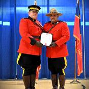 Cst. Bali receiving award from BC RCMP A/Commr. Brewer